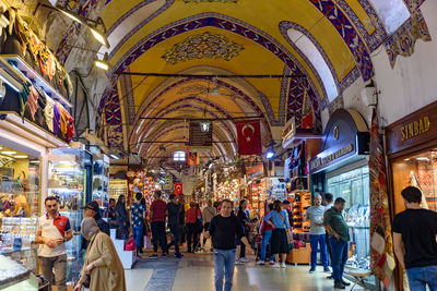 People walking on street market in city