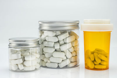 Close-up of bottles against white background