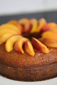 Close-up of peaches garnished on cake