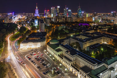 High angle view of city lit up at night