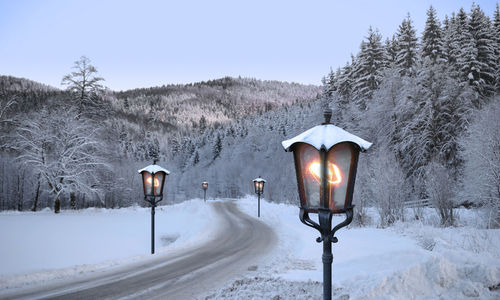 Street light on snow covered field