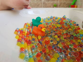 Close-up of hand holding multi colored toy