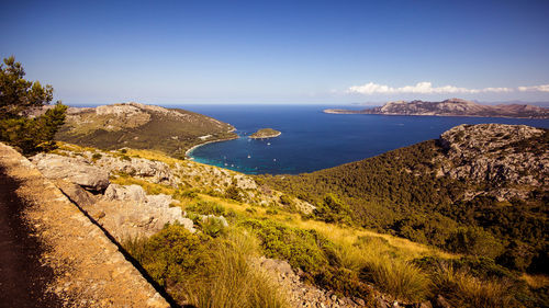 High angle view of bay against clear blue sky