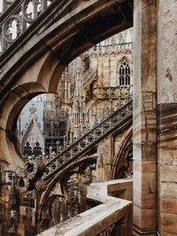 Low angle view of arch bridge in city