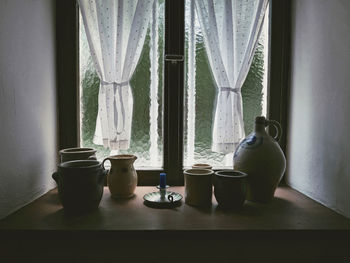 Close-up of vase on window sill