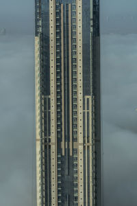 Modern buildings against sky in city