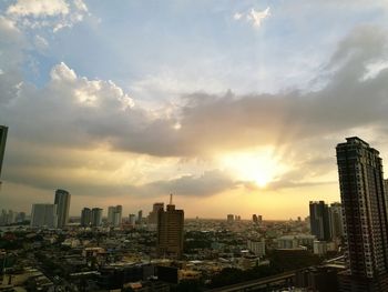 Cityscape against sky during sunset