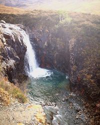 Scenic view of water flowing through rocks