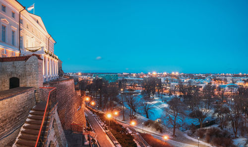 High angle view of illuminated buildings in city