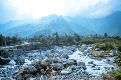 Scenic view of snow covered mountains against sky