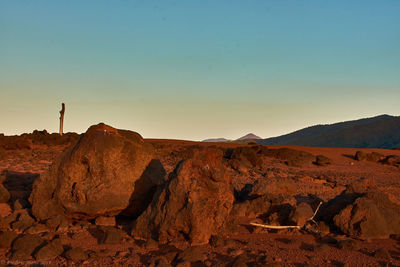 Scenic view of desert against sky during sunset