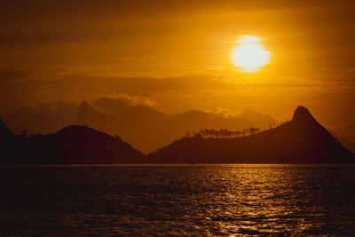 Scenic view of sea against romantic sky during sunset