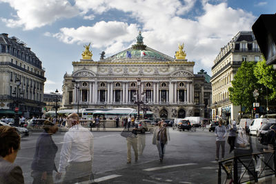 Group of people in front of buildings