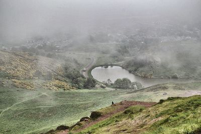 Lake along countryside landscape