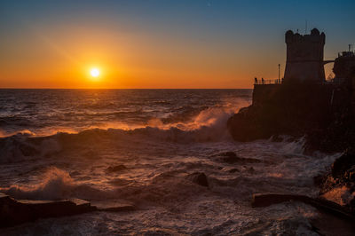 Waves on the promenade on the cliffs of nervi, in the outskirts of genoa, italy