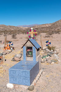 View of cemetery against clear blue sky