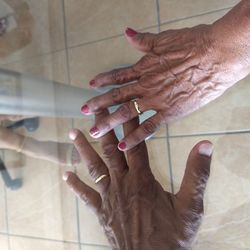 High angle view of people hands on tiled floor