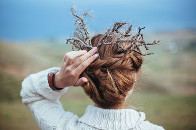 Rear view of woman with hands