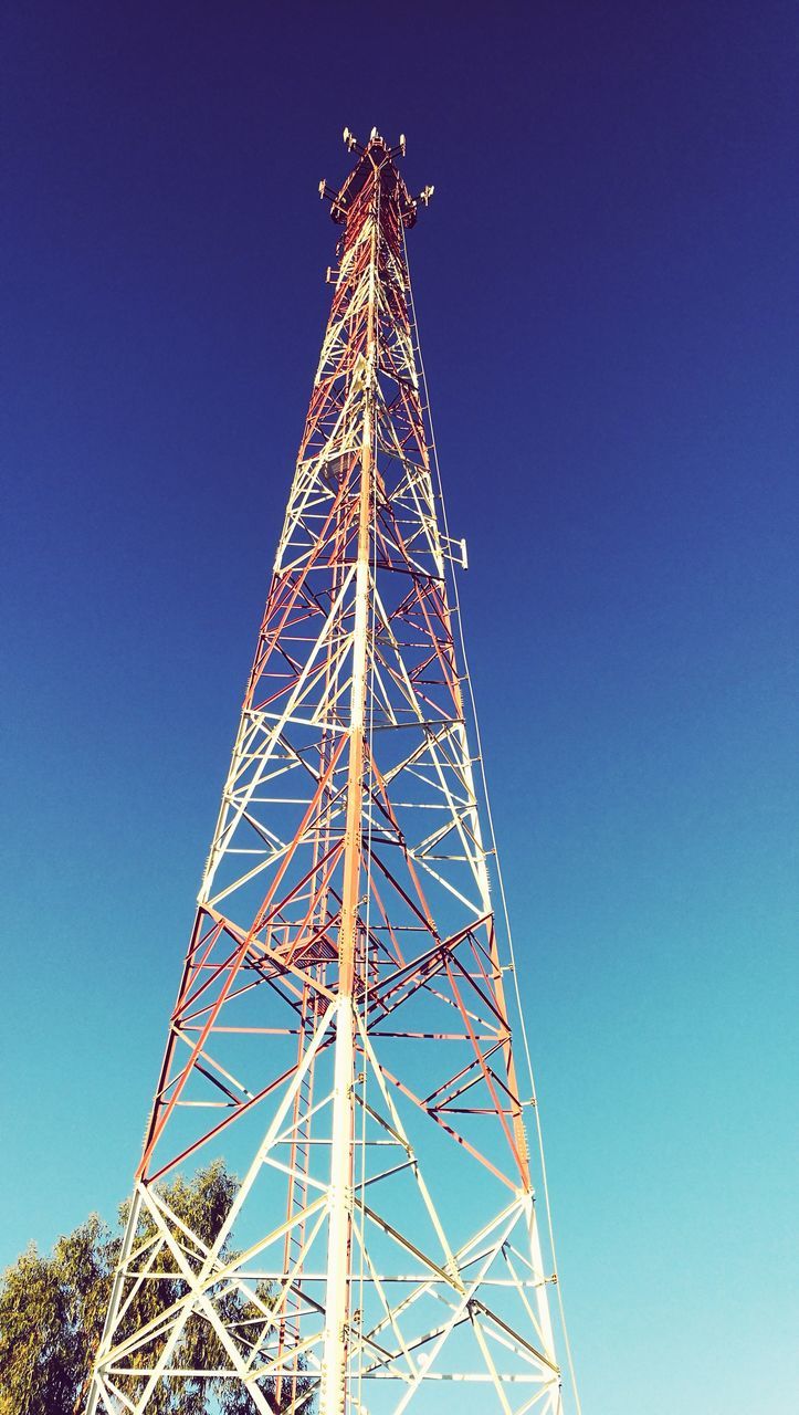 low angle view, clear sky, tower, blue, broadcasting, communication, no people, global communications, technology, day, outdoors, telecommunications equipment, built structure, wireless technology, sky, drilling rig