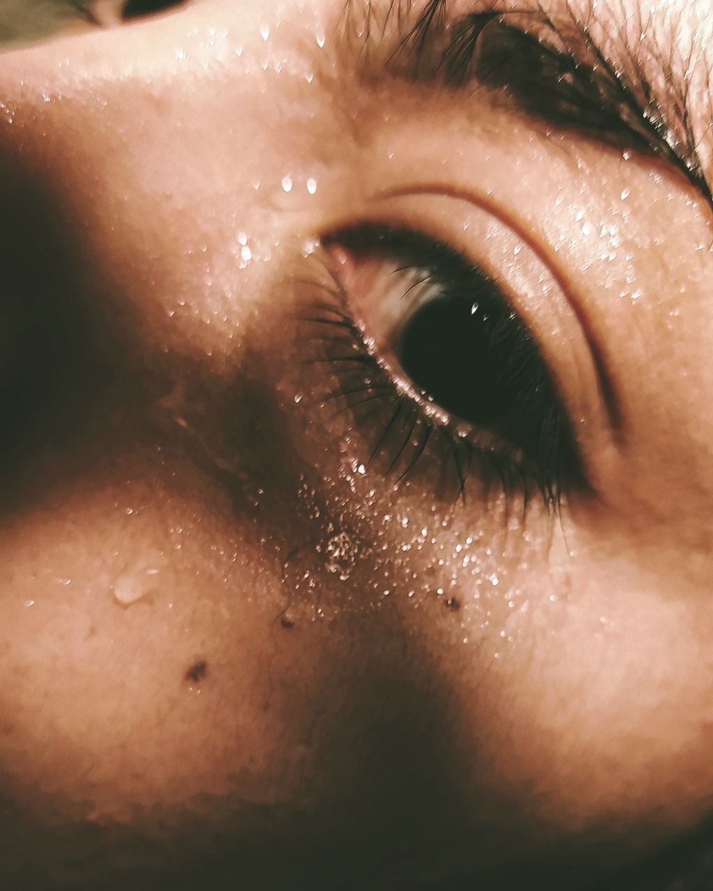 EXTREME CLOSE-UP OF WOMAN EYE