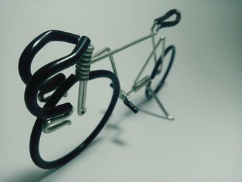 High angle view of eyeglasses on table against white background