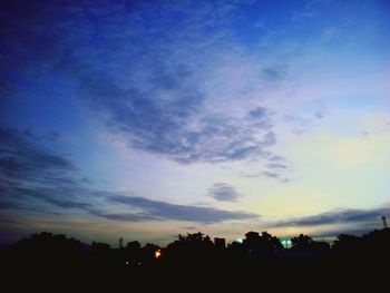 Silhouette trees against sky during sunset