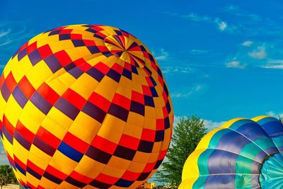 Low angle view of hot air balloon against blue sky