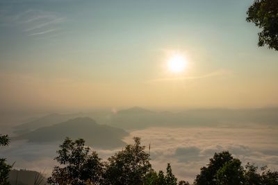 Scenic view of silhouette mountains against sky at sunset