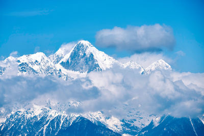 Scenic view of snowcapped mountains against sky