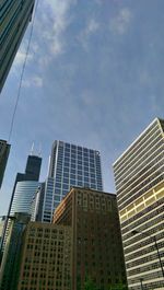 Low angle view of skyscrapers against sky