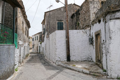 Footpath amidst buildings in town