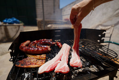 Smoked bacon, on a homemade barbeque in a private home