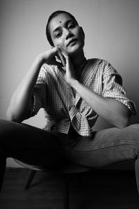 Young woman sitting on table