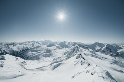 Scenic view of snowcapped mountains against sky