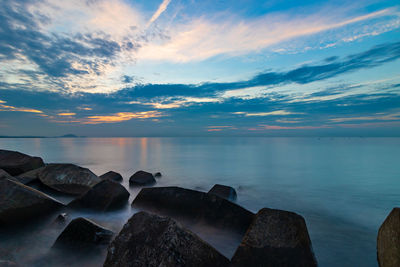 Scenic view of sea against sky at sunset