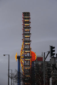 Low angle view of illuminated building against sky