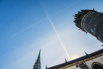 Low angle view of buildings against blue sky