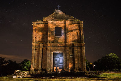 Church against sky at night