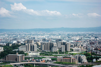 High angle view of buildings in city against sky