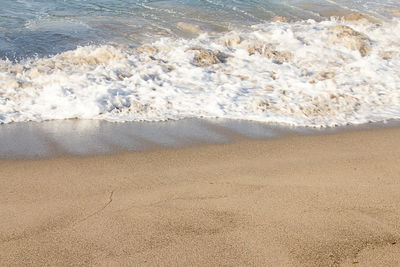 High angle view of surf on beach