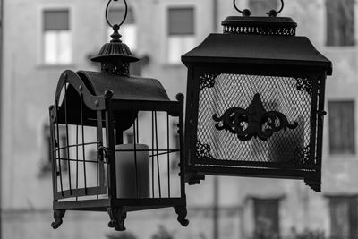 Close-up of lantern hanging in cage
