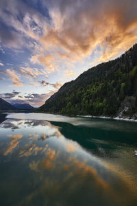 Scenic view of lake against sky during sunset