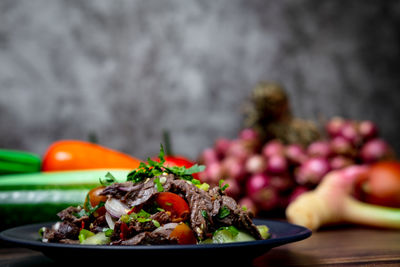 Close-up of fruits in plate on table