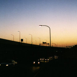 Street light against sky at dusk