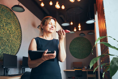 Young woman using mobile phone