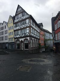 Buildings in city against sky