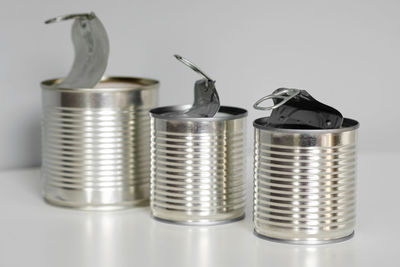 Close-up of coins on table against white background