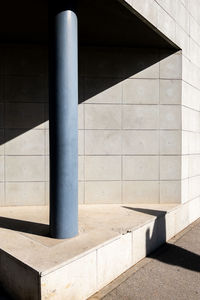 Abstract composition with gray wall and a column