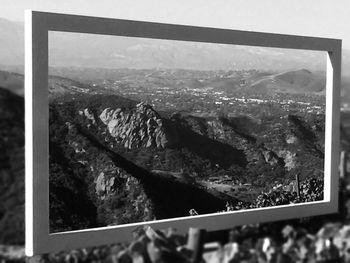 Scenic view of mountains seen through railing