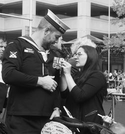 Young woman holding food outdoors